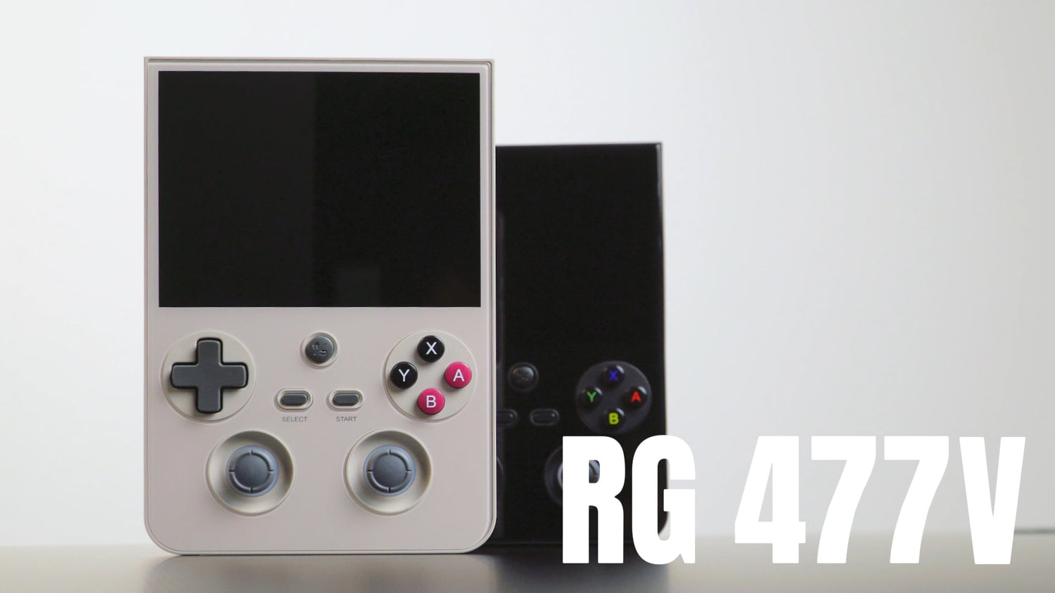 Beige and black RG 477V vertical handheld game consoles.