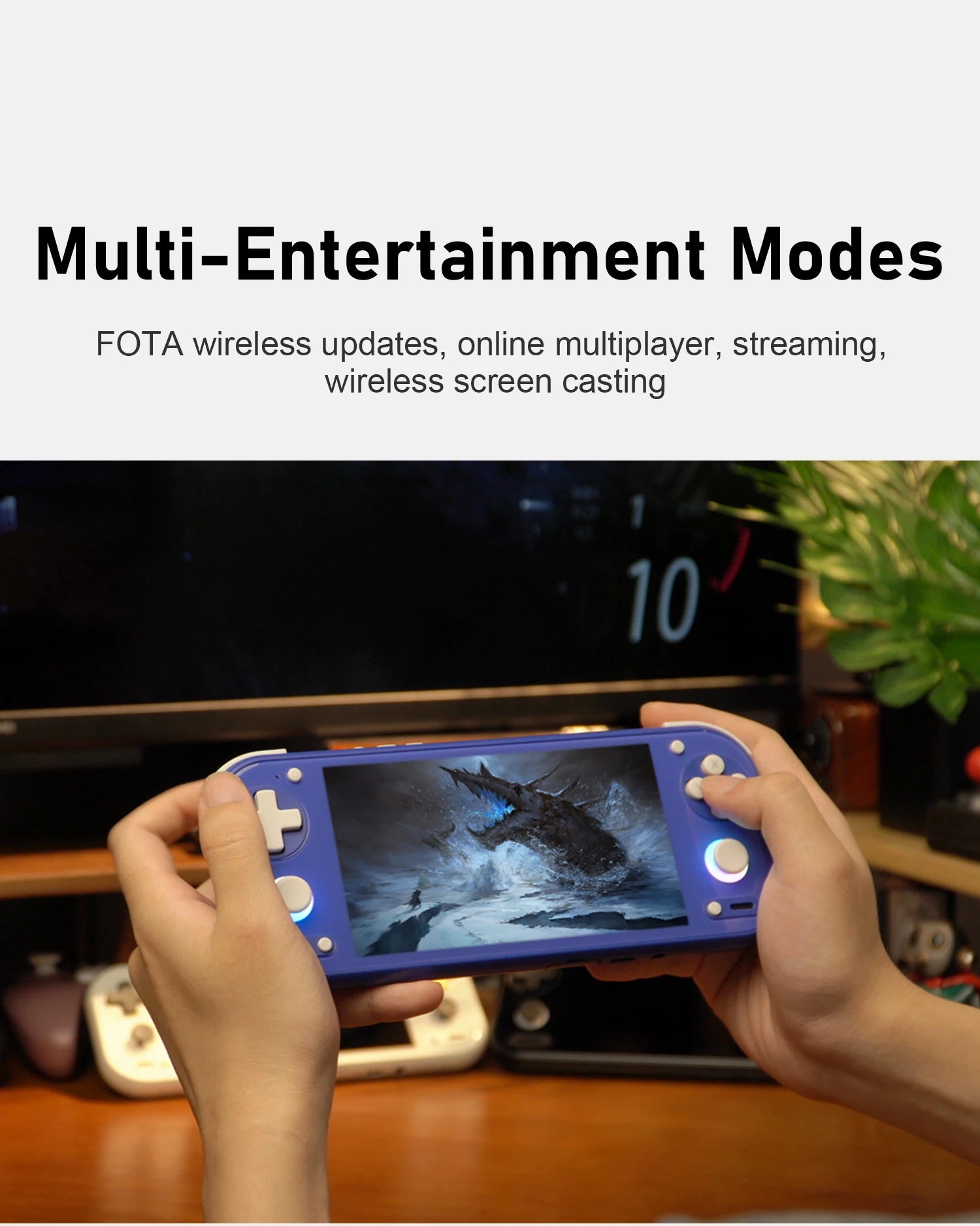 Hands holding a blue handheld console with game on screen and text on multi-entertainment modes including FOTA and streaming